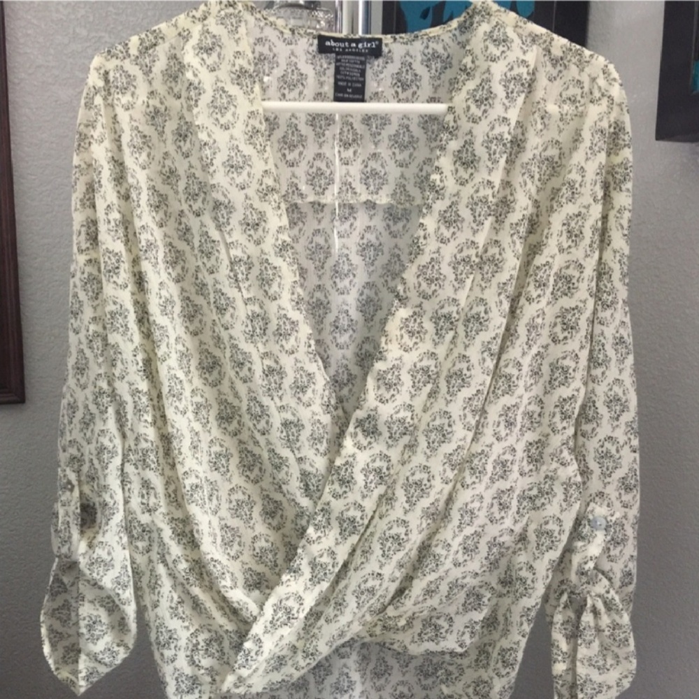 Ivory with navy print faux wrap surplus blouse